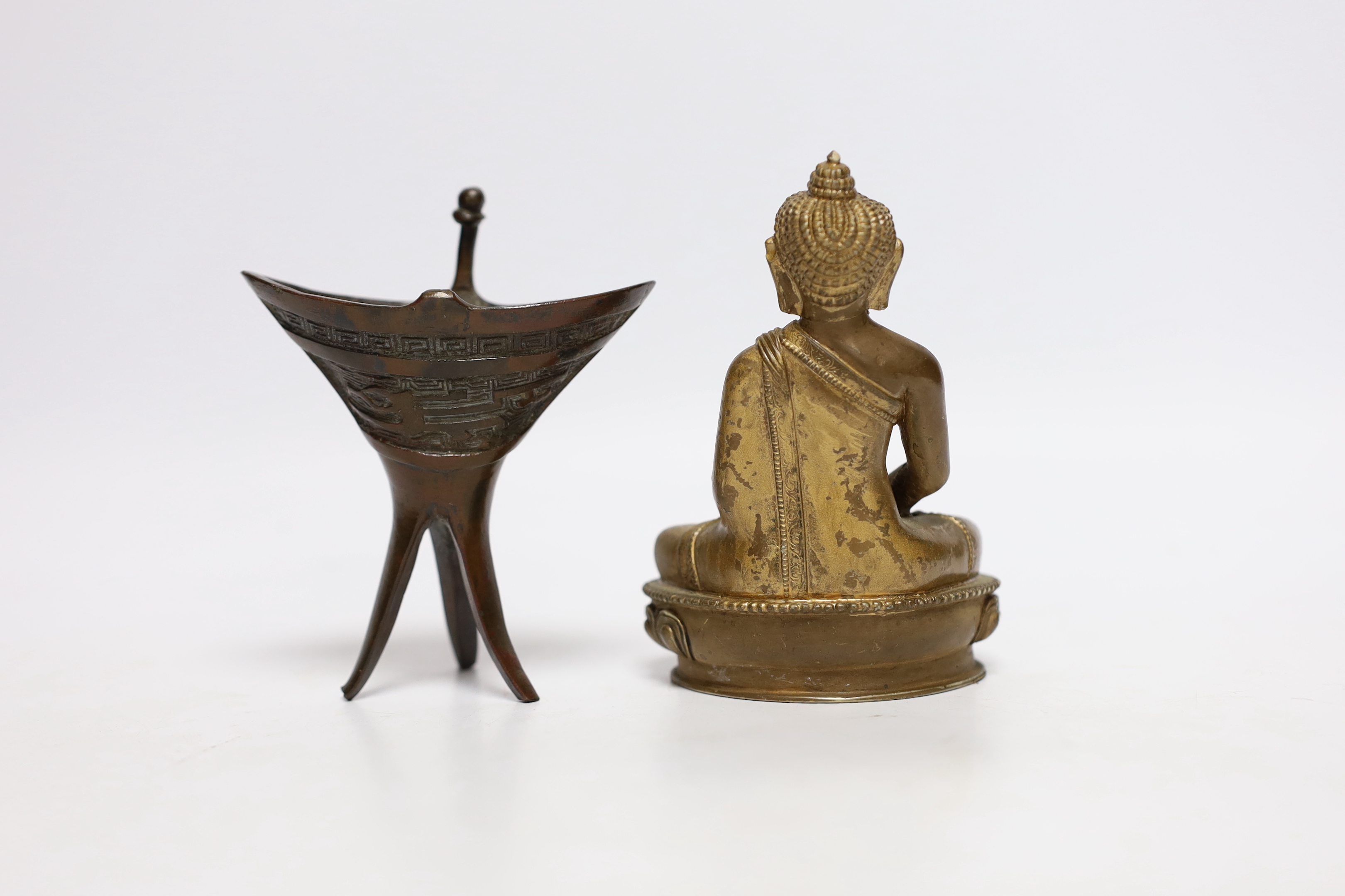 A Chinese archaistic bronze jue vessel and a bronzed plaster figure of Buddha, tallest 11.5cm